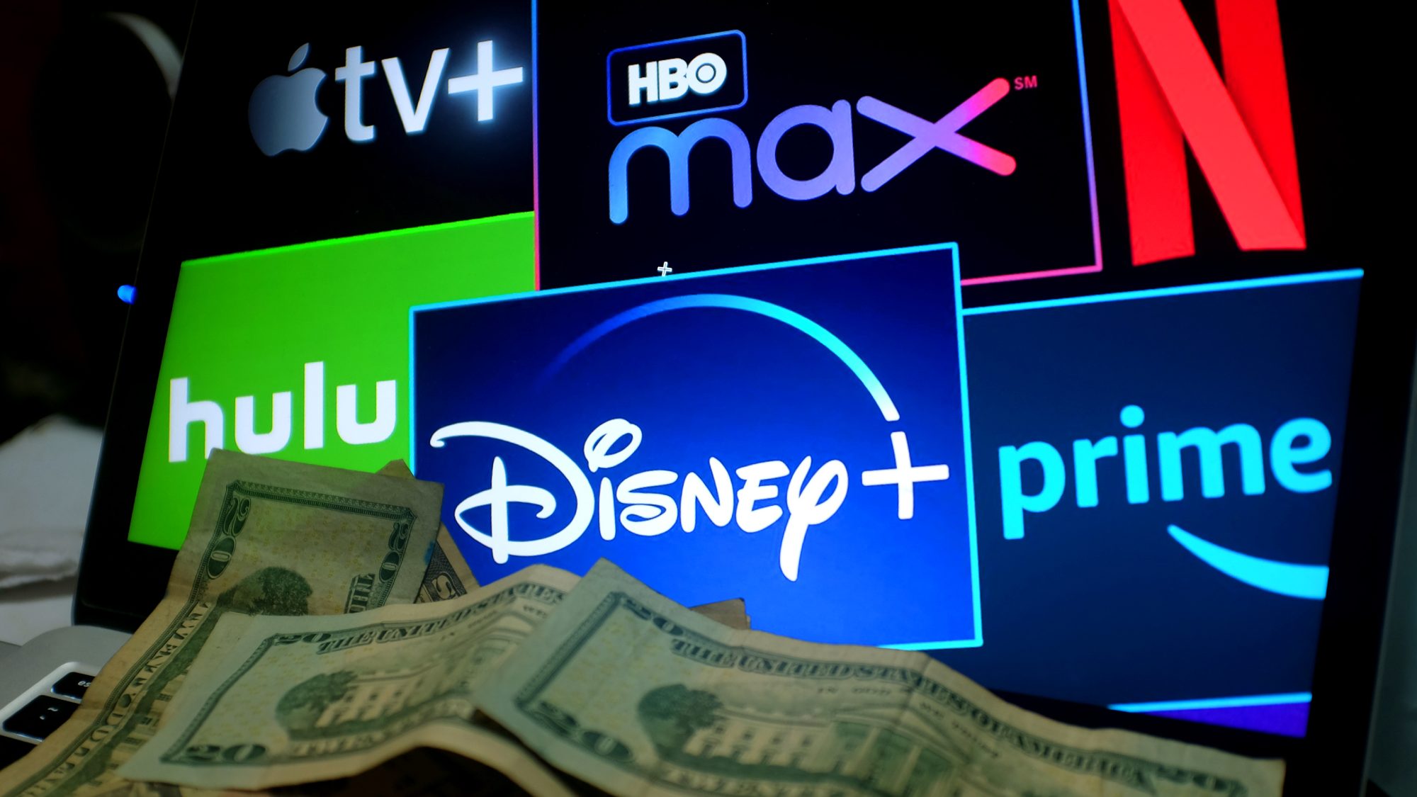 popular streaming services including Apple TV+, HBO Max, Netflix, Hulu, Disney+, and Amazon Prime with dollar bills in the foreground