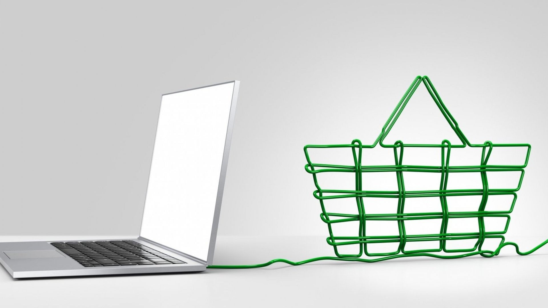 A laptop connected to a green wireframe shopping basket, symbolizing an Ecommerce Store for online shopping.